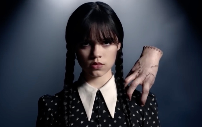 full body of a Wednesday Addams (Jenna Ortega) harvests poisonous